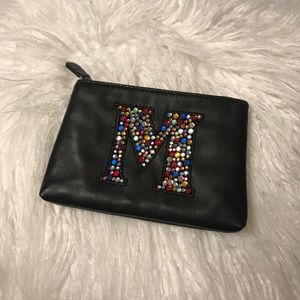 NWT’s Bloomingdales rhinestone “M” zip bag